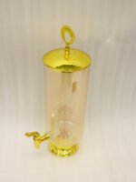 Luxury 3.5L amber ribbed glass beverage dispenser with ornate gold base, spigot, and lid handle on a kitchen countertop.