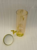 Luxury 3.5L amber ribbed glass beverage dispenser with ornate gold base, spigot, and lid handle on a kitchen countertop.