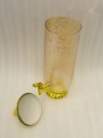 3.5-liter clear hammered glass beverage dispenser with polished gold lid ring handle and spigot on a kitchen counter