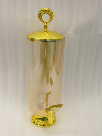 3.5 liter ribbed glass beverage dispenser with polished gold base, lid, and spigot on a kitchen counter
