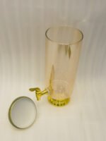 3.5 liter ribbed glass beverage dispenser with polished gold base, lid, and spigot on a kitchen counter