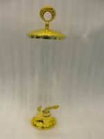 3.5 liter ribbed glass beverage dispenser with polished gold base, lid, and spigot on a kitchen counter