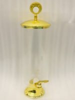 3.5 liter ribbed glass beverage dispenser with polished gold base, lid, and spigot on a kitchen counter
