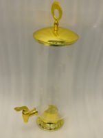 3.5 liter ribbed glass beverage dispenser with polished gold base, lid, and spigot on a kitchen counter