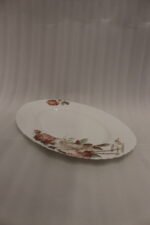 38 piece opal glass dinner set with vintage floral rose patterns on a wooden dining table