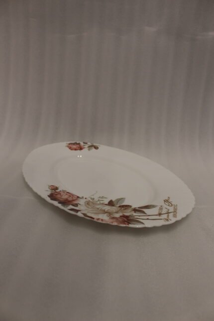 38 piece opal glass dinner set with vintage floral rose patterns on a wooden dining table