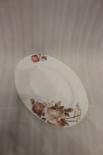 38 piece opal glass dinner set with vintage floral rose patterns on a wooden dining table