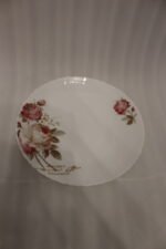 38 piece opal glass dinner set with vintage floral rose patterns on a wooden dining table