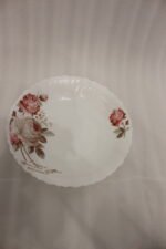 38 piece opal glass dinner set with vintage floral rose patterns on a wooden dining table