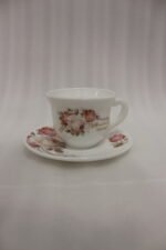 38 piece opal glass dinner set with vintage floral rose patterns on a wooden dining table