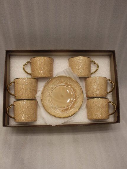 Elegantly boxed beige ceramic 6-person cup and saucer set featuring textured patterns and gold trim handles.
