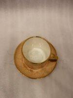 Elegantly boxed beige ceramic 6-person cup and saucer set featuring textured patterns and gold trim handles.