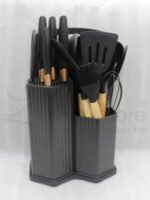 Matte dark grey 19-piece kitchen utensil and knife block set with rose gold accents and wooden handles on a marble countertop.
