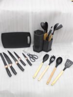 Matte dark grey 19-piece kitchen utensil and knife block set with rose gold accents and wooden handles on a marble countertop.