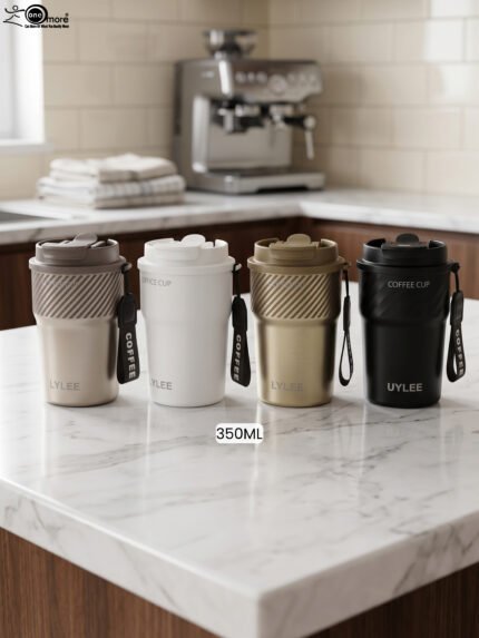Four 350ml LYLEE insulated travel coffee mugs in taupe, white, olive green, and matte black lined up on a marble countertop.