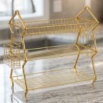 3-tier modern gold stainless steel dish drying rack with utensil basket, cup holder, and clear drip tray on a marble countertop