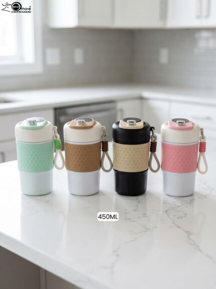 Four 450ml insulated travel coffee mugs in mint green, brown, black, and pink with textured silicone grips and wrist straps on a kitchen counter
