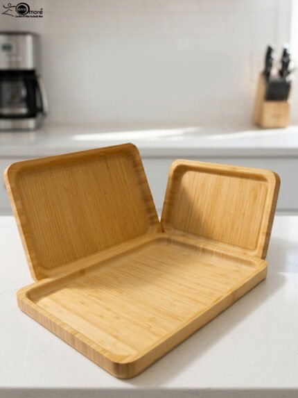 3 piece natural wooden serving tray set with rounded edges in small medium and large sizes on a kitchen counter