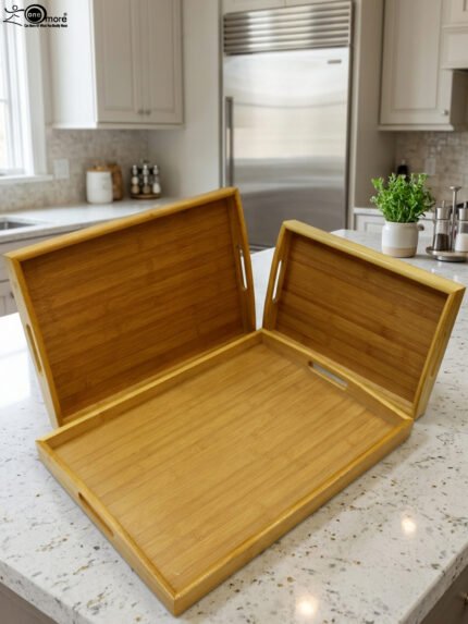 3 piece rectangular wooden serving tray set with built-in cutout handles displayed on a marble kitchen countertop