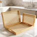 3 piece natural wooden serving tray set with woven cane rattan mesh bottom and side handles on a kitchen countertop