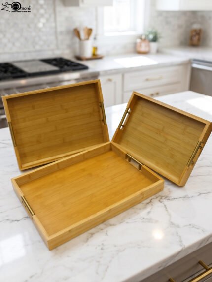 ONEMORE 3 piece natural wooden serving tray set with metallic brass handles resting on a kitchen countertop