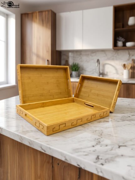 3 piece natural wooden serving tray set with cut-out side handles and engraved geometric border design displayed on a marble kitchen counter