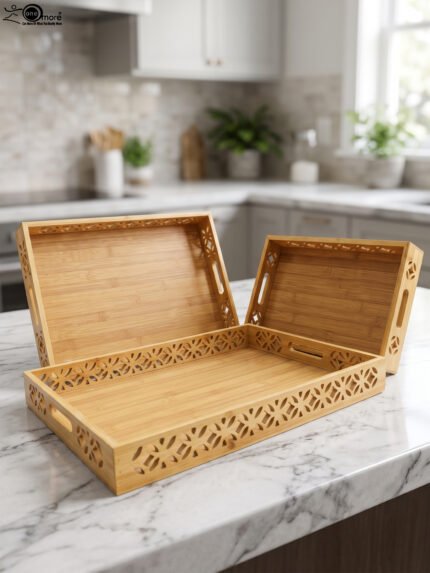 Set of 3 ONEMORE natural wood serving trays with carved geometric side patterns and built-in handles on a marble countertop