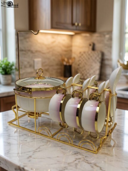 Pink and white gradient ceramic soup tureen set with gold rims, suspended glass lid on a gold frame, buffet burner warmer stand, matching soup cups, saucers, and ceramic spoons.