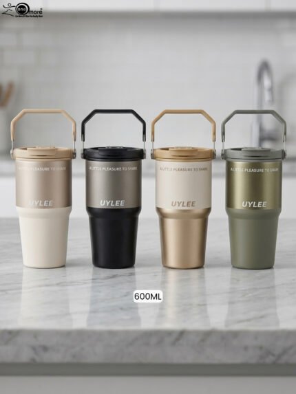 Four UYLEE 600ml stainless steel insulated travel tumblers with folding handles shown in beige, matte black, champagne gold, and olive green on a marble countertop.