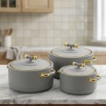 ONEMORE 3-piece modern grey insulated hot pot set with gold handles on a marble countertop