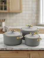 ONEMORE 3-piece modern grey insulated hot pot set with gold handles on a marble countertop
