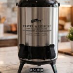 DAY DAYS 9.5 Liter stainless steel insulated hot and cold beverage dispenser with dual spigots on a countertop