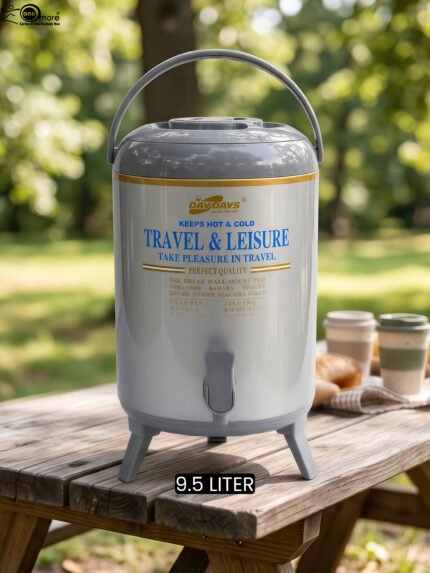 DAYDAYS 9.5-liter gray thermal beverage dispenser jug with dispensing tap and tripod stand sitting on an outdoor wooden picnic table.