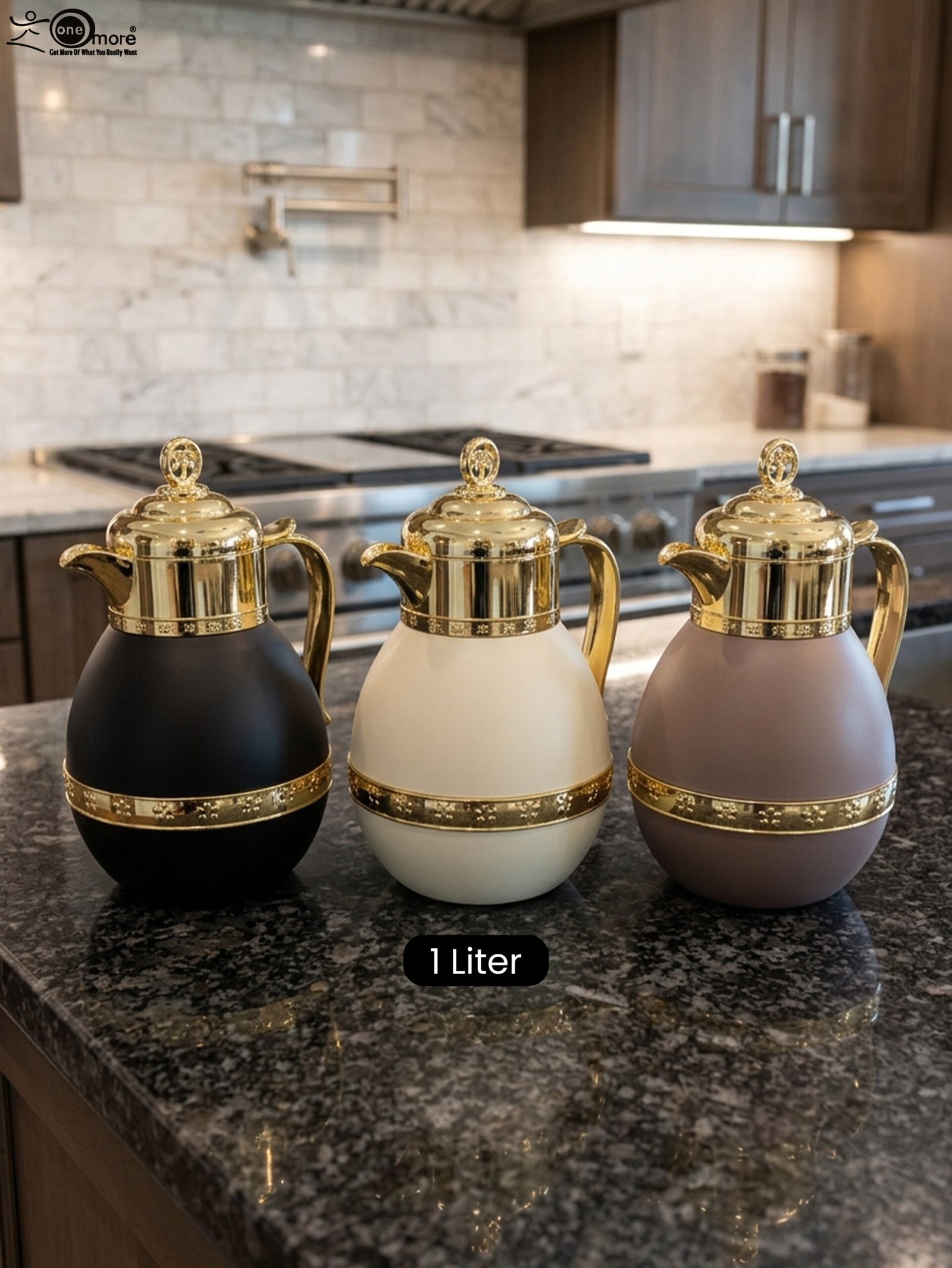 1 Three luxury 1-liter thermal coffee and tea vacuum flasks with ornate gold lids and accents in matte black, cream, and taupe on a granite kitchen countertop.