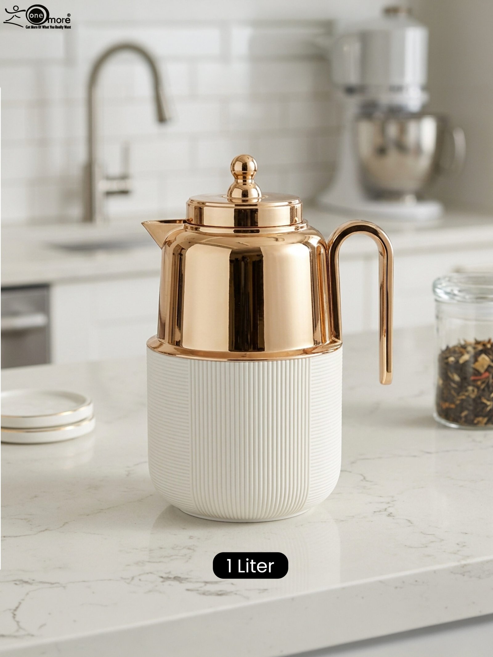 1 One More 1 Liter white fluted thermal flask with a polished rose gold lid, spout, and ergonomic handle on a kitchen countertop.