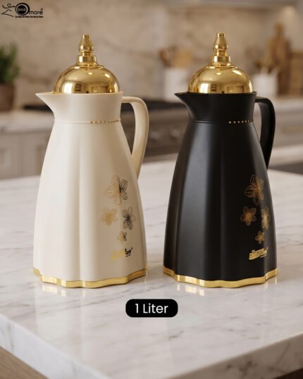 Cream and black 1 liter luxury thermal flasks with ornate gold lids and floral motifs on a marble kitchen countertop.Cream and black 1 liter luxury thermal flasks with ornate gold lids and floral motifs on a marble kitchen countertop.Cream and black 1 liter luxury thermal flasks with ornate gold lids and floral motifs on a marble kitchen countertop.