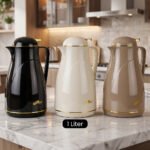 Three DAYDAYS 1L thermal vacuum flasks in black, cream, and beige with gold trim on a marble kitchen countertop.Three DAYDAYS 1L thermal vacuum flasks in black, cream, and beige with gold trim on a marble kitchen countertop.Three DAYDAYS 1L thermal vacuum flasks in black, cream, and beige with gold trim on a marble kitchen countertop.