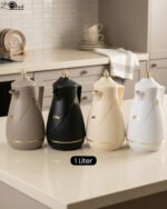 Four One More 1-liter thermal vacuum tea and coffee flasks in taupe, matte black, cream, and white with elegant gold accents on a modern kitchen counter.Four One More 1-liter thermal vacuum tea and coffee flasks in taupe, matte black, cream, and white with elegant gold accents on a modern kitchen counter.