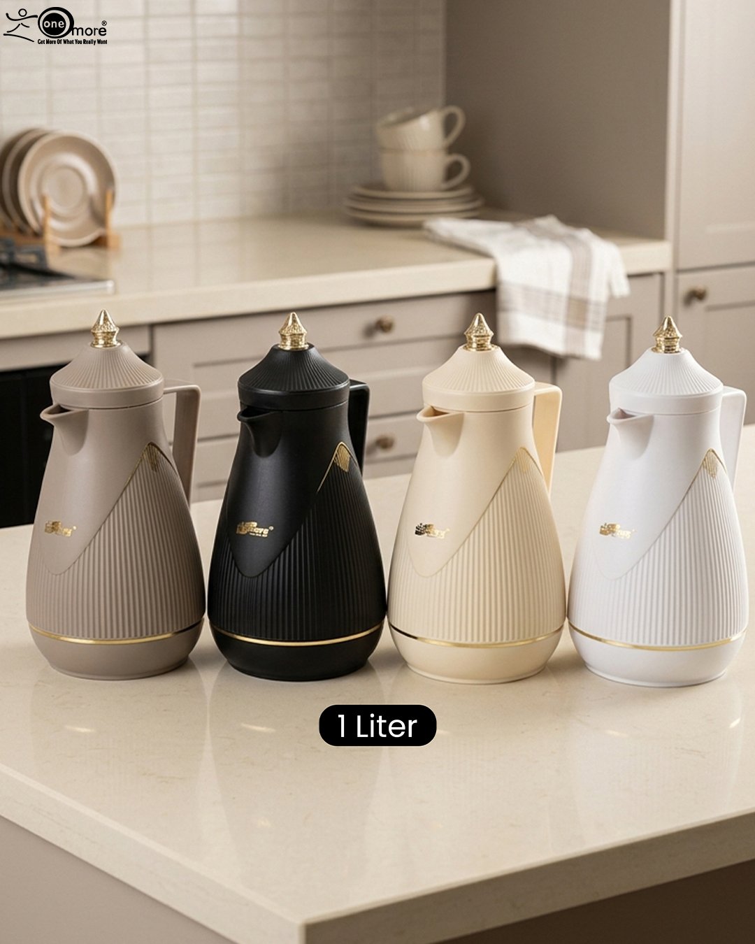 1 Four One More 1-liter thermal vacuum tea and coffee flasks in taupe, matte black, cream, and white with elegant gold accents on a modern kitchen counter.Four One More 1-liter thermal vacuum tea and coffee flasks in taupe, matte black, cream, and white with elegant gold accents on a modern kitchen counter.