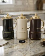 Three luxury 1-liter MIXFF vacuum flasks in black, cream, and dark brown with gold handles and spouts on a marble countertop.Three luxury 1-liter MIXFF vacuum flasks in black, cream, and dark brown with gold handles and spouts on a marble countertop.Three luxury 1-liter MIXFF vacuum flasks in black, cream, and dark brown with gold handles and spouts on a marble countertop.Three luxury 1-liter MIXFF vacuum flasks in black, cream, and dark brown with gold handles and spouts on a marble countertop.