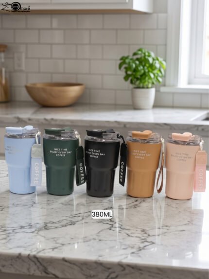 Set of 380ml portable travel coffee mugs in light blue, dark green, matte black, camel, and pink with attached wrist straps on a marble countertop.