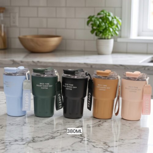 Set of 380ml portable travel coffee mugs in light blue, dark green, matte black, camel, and pink with attached wrist straps on a marble countertop.