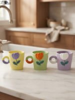Pastel ceramic coffee mugs with 3D embossed tulip flower designs and circular ring handles placed on a kitchen countertop.Pastel ceramic coffee mugs with 3D embossed tulip flower designs and circular ring handles placed on a kitchen countertop.Pastel ceramic coffee mugs with 3D embossed tulip flower designs and circular ring handles placed on a kitchen countertop.Pastel ceramic coffee mugs with 3D embossed tulip flower designs and circular ring handles placed on a kitchen countertop.Pastel ceramic coffee mugs with 3D embossed tulip flower designs and circular ring handles placed on a kitchen countertop.Pastel ceramic coffee mugs with 3D embossed tulip flower designs and circular ring handles placed on a kitchen countertop.Pastel ceramic coffee mugs with 3D embossed tulip flower designs and circular ring handles placed on a kitchen countertop.Pastel ceramic coffee mugs with 3D embossed tulip flower designs and circular ring handles placed on a kitchen countertop.Pastel ceramic coffee mugs with 3D embossed tulip flower designs and circular ring handles placed on a kitchen countertop.Pastel ceramic coffee mugs with 3D embossed tulip flower designs and circular ring handles placed on a kitchen countertop.Pastel ceramic coffee mugs with 3D embossed tulip flower designs and circular ring handles placed on a kitchen countertop.Pastel ceramic coffee mugs with 3D embossed tulip flower designs and circular ring handles placed on a kitchen countertop.Pastel ceramic coffee mugs with 3D embossed tulip flower designs and circular ring handles placed on a kitchen countertop.Pastel ceramic coffee mugs with 3D embossed tulip flower designs and circular ring handles placed on a kitchen countertop.Pastel ceramic coffee mugs with 3D embossed tulip flower designs and circular ring handles placed on a kitchen countertop.Pastel ceramic coffee mugs with 3D embossed tulip flower designs and circular ring handles placed on a kitchen countertop.Pastel ceramic coffee mugs with 3D embossed tulip flower designs and circular ring handles placed on a kitchen countertop.Pastel ceramic coffee mugs with 3D embossed tulip flower designs and circular ring handles placed on a kitchen countertop.Pastel ceramic coffee mugs with 3D embossed tulip flower designs and circular ring handles placed on a kitchen countertop.Pastel ceramic coffee mugs with 3D embossed tulip flower designs and circular ring handles placed on a kitchen countertop.Pastel ceramic coffee mugs with 3D embossed tulip flower designs and circular ring handles placed on a kitchen countertop.