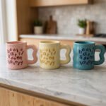 Three pastel ceramic coffee mugs in pink, light yellow, and blue featuring typography lettering and wavy handles on a marble kitchen counter.Three pastel ceramic coffee mugs in pink, light yellow, and blue featuring typography lettering and wavy handles on a marble kitchen counter.Three pastel ceramic coffee mugs in pink, light yellow, and blue featuring typography lettering and wavy handles on a marble kitchen counter.Three pastel ceramic coffee mugs in pink, light yellow, and blue featuring typography lettering and wavy handles on a marble kitchen counter.Three pastel ceramic coffee mugs in pink, light yellow, and blue featuring typography lettering and wavy handles on a marble kitchen counter.Three pastel ceramic coffee mugs in pink, light yellow, and blue featuring typography lettering and wavy handles on a marble kitchen counter.Three pastel ceramic coffee mugs in pink, light yellow, and blue featuring typography lettering and wavy handles on a marble kitchen counter.Three pastel ceramic coffee mugs in pink, light yellow, and blue featuring typography lettering and wavy handles on a marble kitchen counter.Three pastel ceramic coffee mugs in pink, light yellow, and blue featuring typography lettering and wavy handles on a marble kitchen counter.Three pastel ceramic coffee mugs in pink, light yellow, and blue featuring typography lettering and wavy handles on a marble kitchen counter.Three pastel ceramic coffee mugs in pink, light yellow, and blue featuring typography lettering and wavy handles on a marble kitchen counter.Three pastel ceramic coffee mugs in pink, light yellow, and blue featuring typography lettering and wavy handles on a marble kitchen counter.Three pastel ceramic coffee mugs in pink, light yellow, and blue featuring typography lettering and wavy handles on a marble kitchen counter.Three pastel ceramic coffee mugs in pink, light yellow, and blue featuring typography lettering and wavy handles on a marble kitchen counter.Three pastel ceramic coffee mugs in pink, light yellow, and blue featuring typography lettering and wavy handles on a marble kitchen counter.