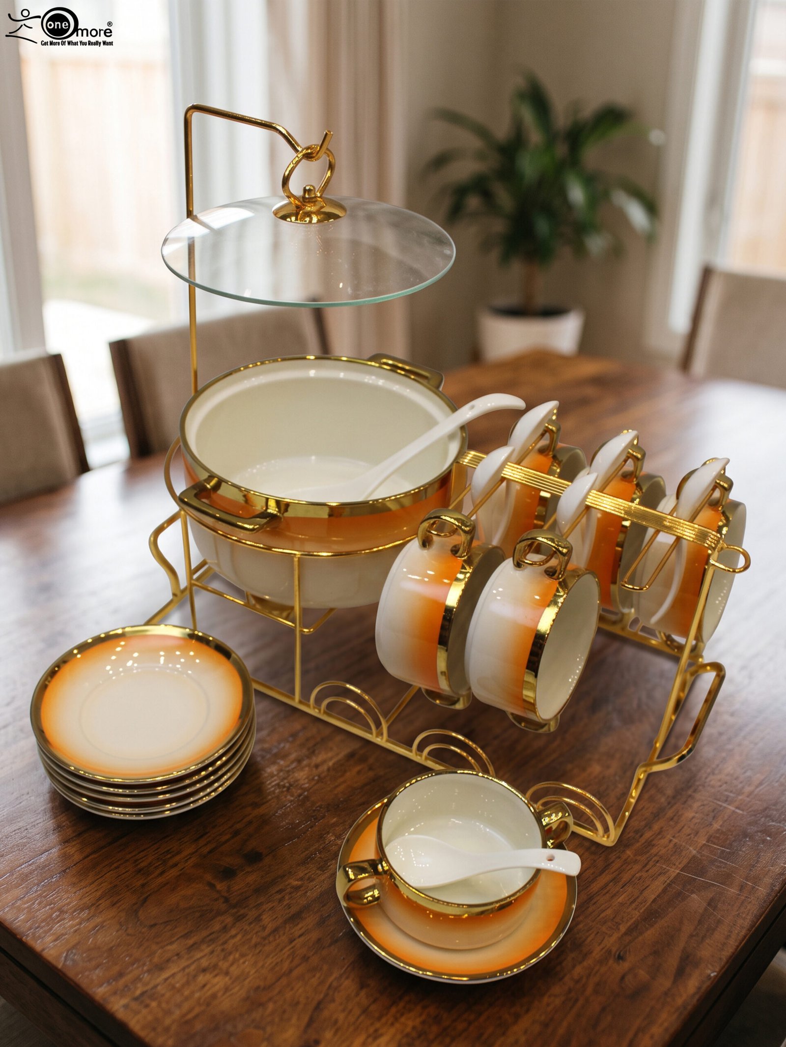 2 Ceramic soup tureen set with orange gradient rims and gold accents, including hanging soup cups, saucers, and spoons organized on a gold metal rack.