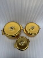 3-piece luxury brushed gold insulated hot pot set with clear acrylic lid handles on a kitchen counter