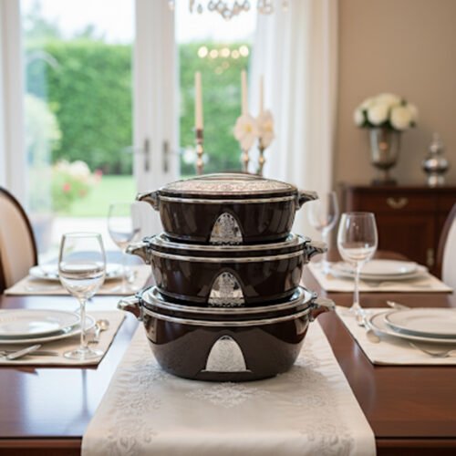 3-piece stacked luxury insulated hot pot casserole set in dark brown with silver chrome trim on a dining table setup.