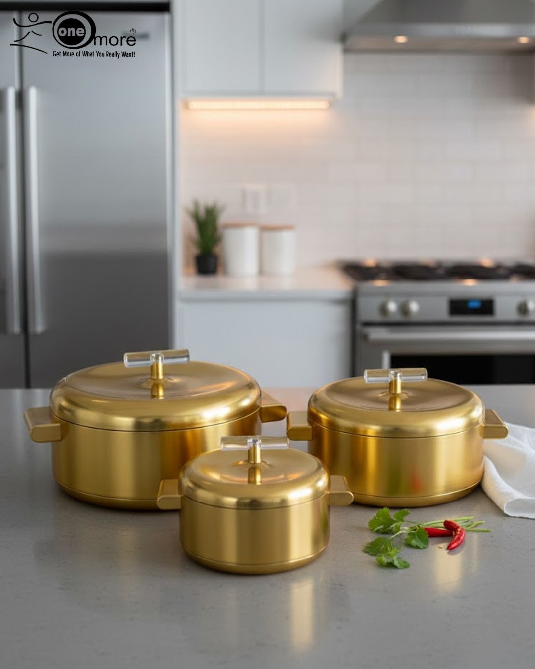 2.1 3-piece luxury brushed gold insulated hot pot set with clear acrylic lid handles on a kitchen counter