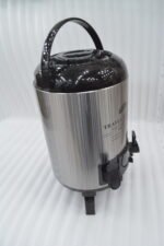DAY DAYS 9.5 Liter stainless steel insulated hot and cold beverage dispenser with dual spigots on a countertop