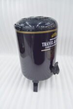 Day Days 9.5 Liter dark blue insulated water cooler jug with spigot tap and tripod legs set on an outdoor picnic table.